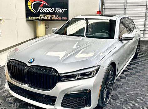 White BMW 7 Series after window tint at Turbo Tint Cary